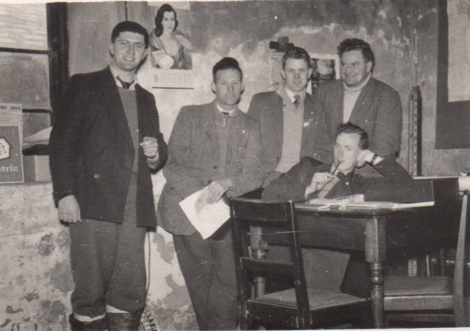 Tim Slevin with four ESB colleagues gathered around a table in an office setting.