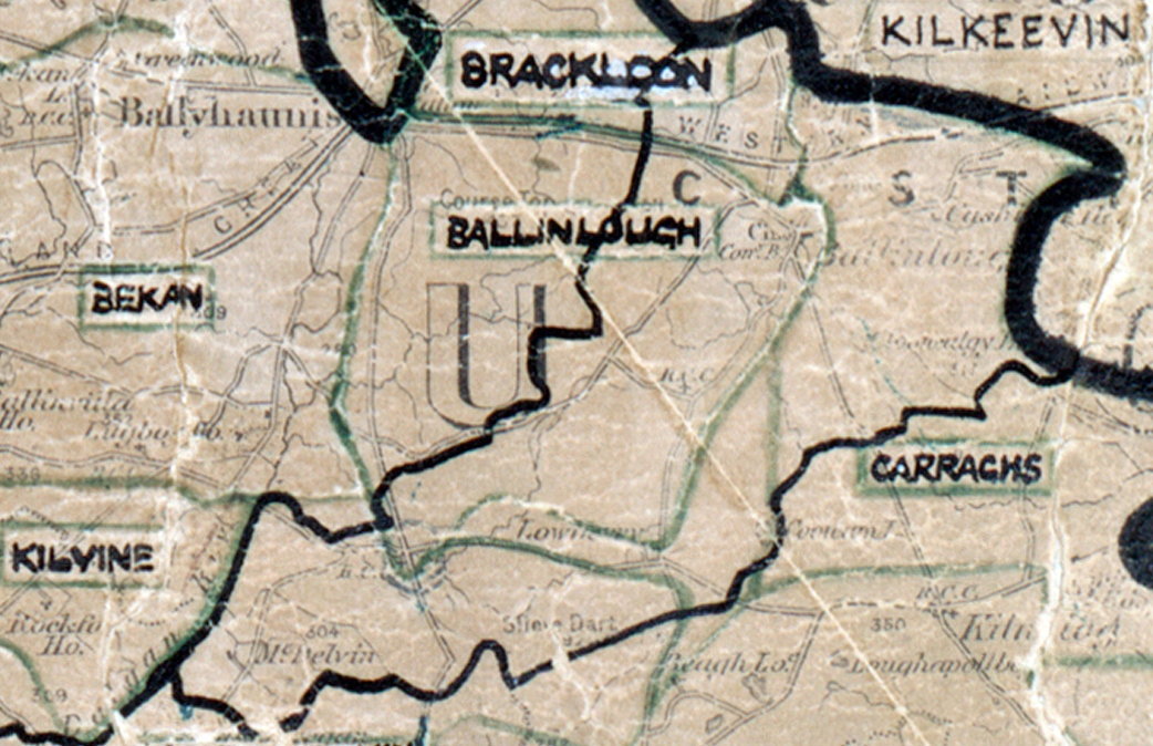 A scanned, worn historical map from the 1940s of the  rural electrification area around Ballinlough. A hand‑drawn boundary outlines the region, including Kilkeevin, Brackloon, Bekan, Carraghs and Kilvine.