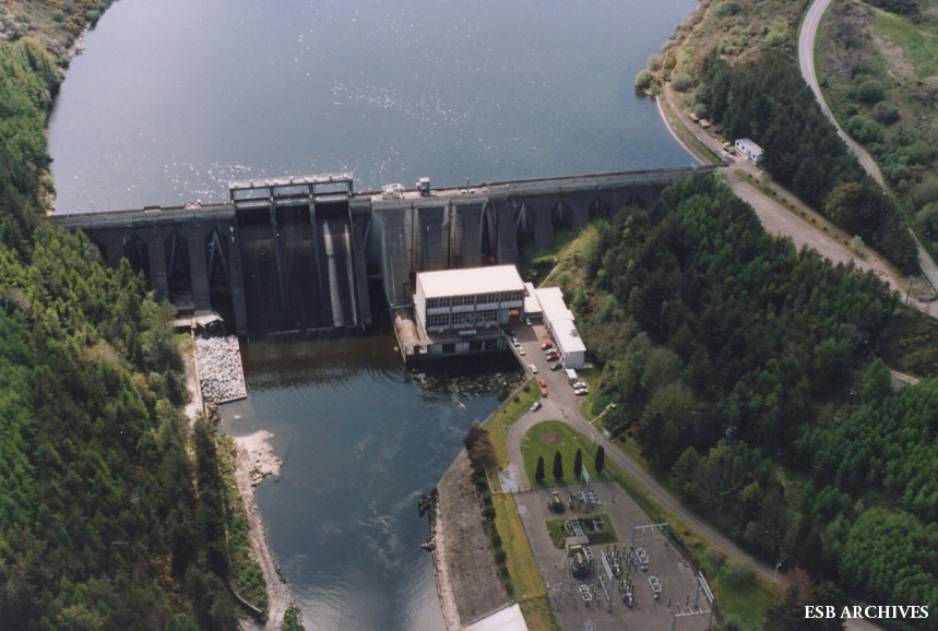 Aerial view of Inniscarra Generating Station, showing the dam, power station buildings and surrounding woodland.