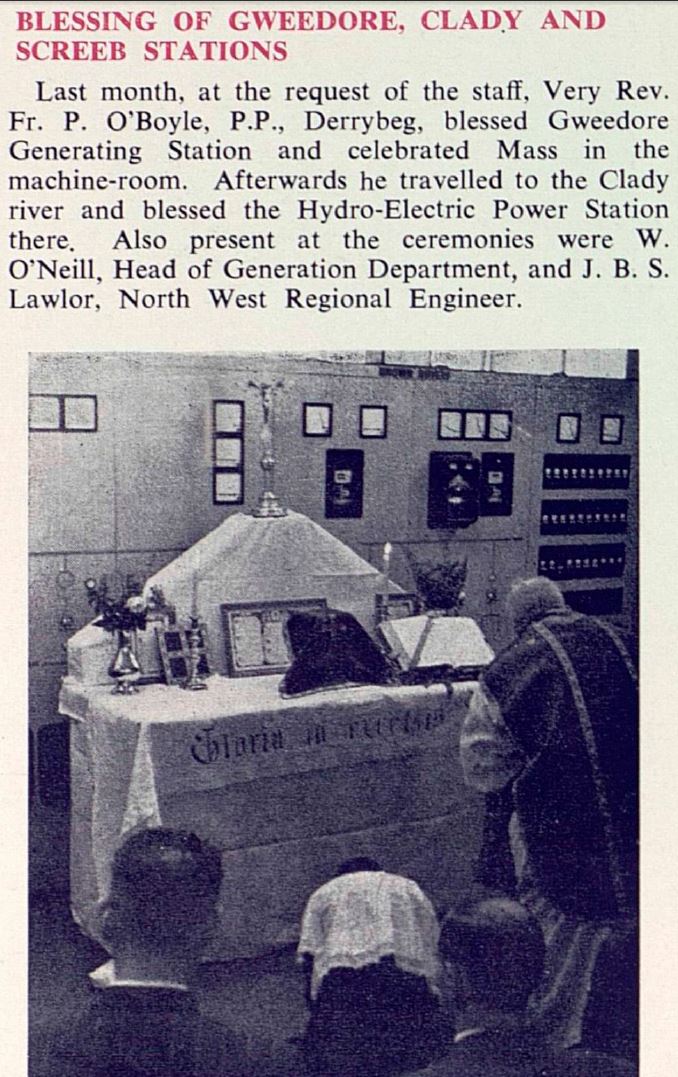 Historical photograph of a religious blessing ceremony inside a power station, showing an altar set up in front of electrical control equipment with attendees gathered nearby.