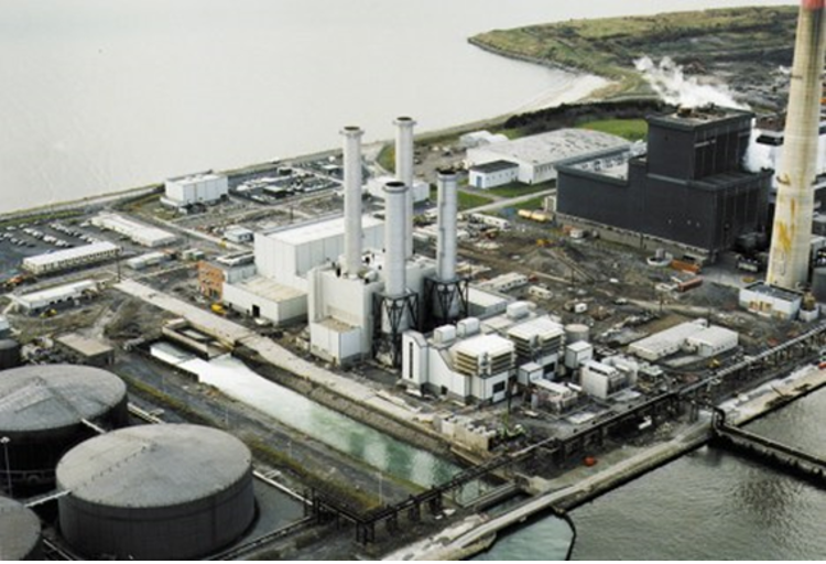 Arial view of Poolbeg generating station with industrial structures and energy production equipment