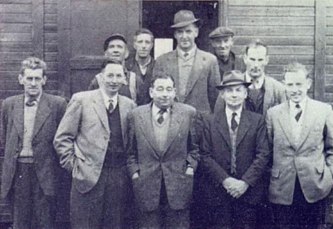 Jerry Corbett and fellow ESB workers posing for a group photograph outside a building at Cork Polefield during the rural electrification programme.