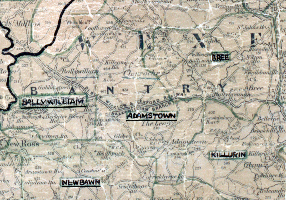 “A scanned, worn historical map from the 1940s of the rural electrification area around Adamstown. A hand‑drawn boundary outlines the region, including Bree and Killurin