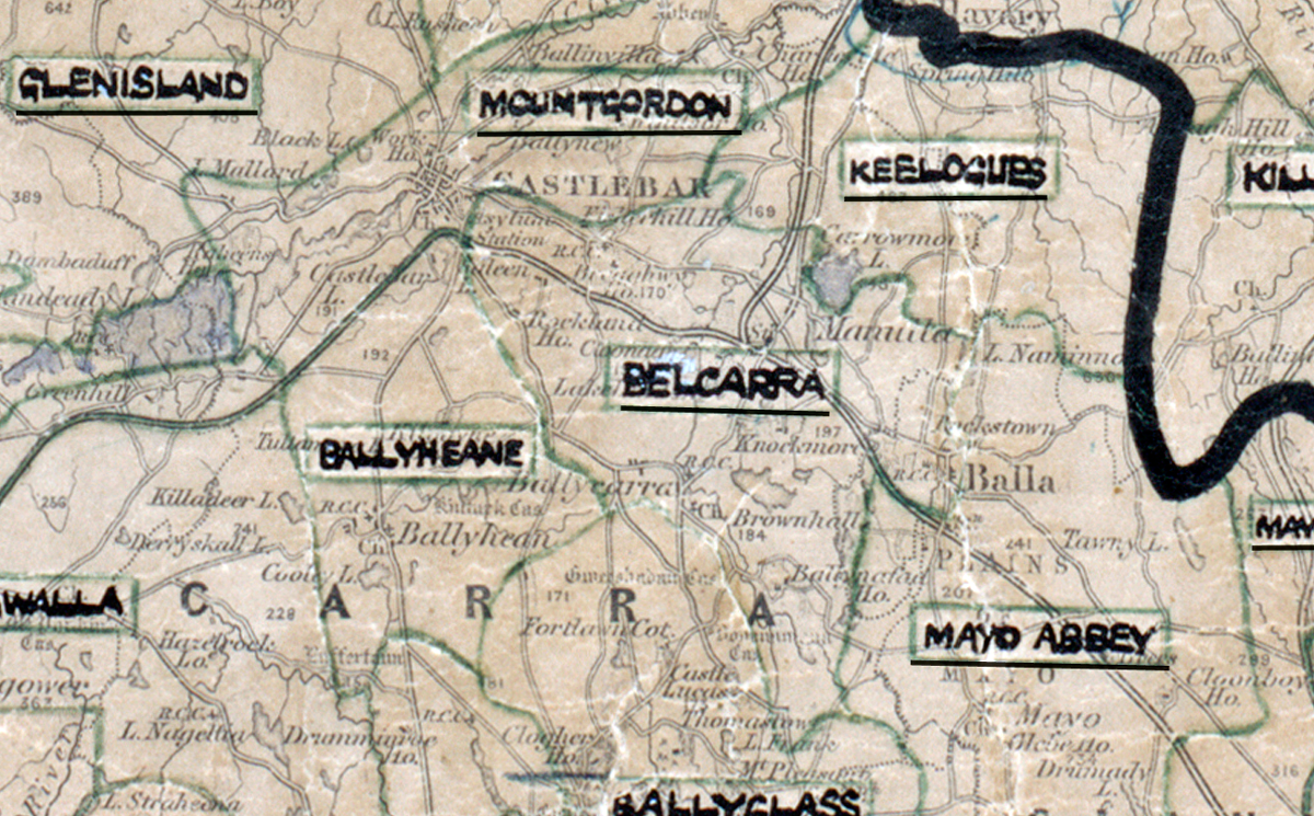“A scanned, worn historical map from the 1940s of the rural electrification area around Belcarra. A hand‑drawn boundary outlines the region, including Ballyheane and Mountgordon.