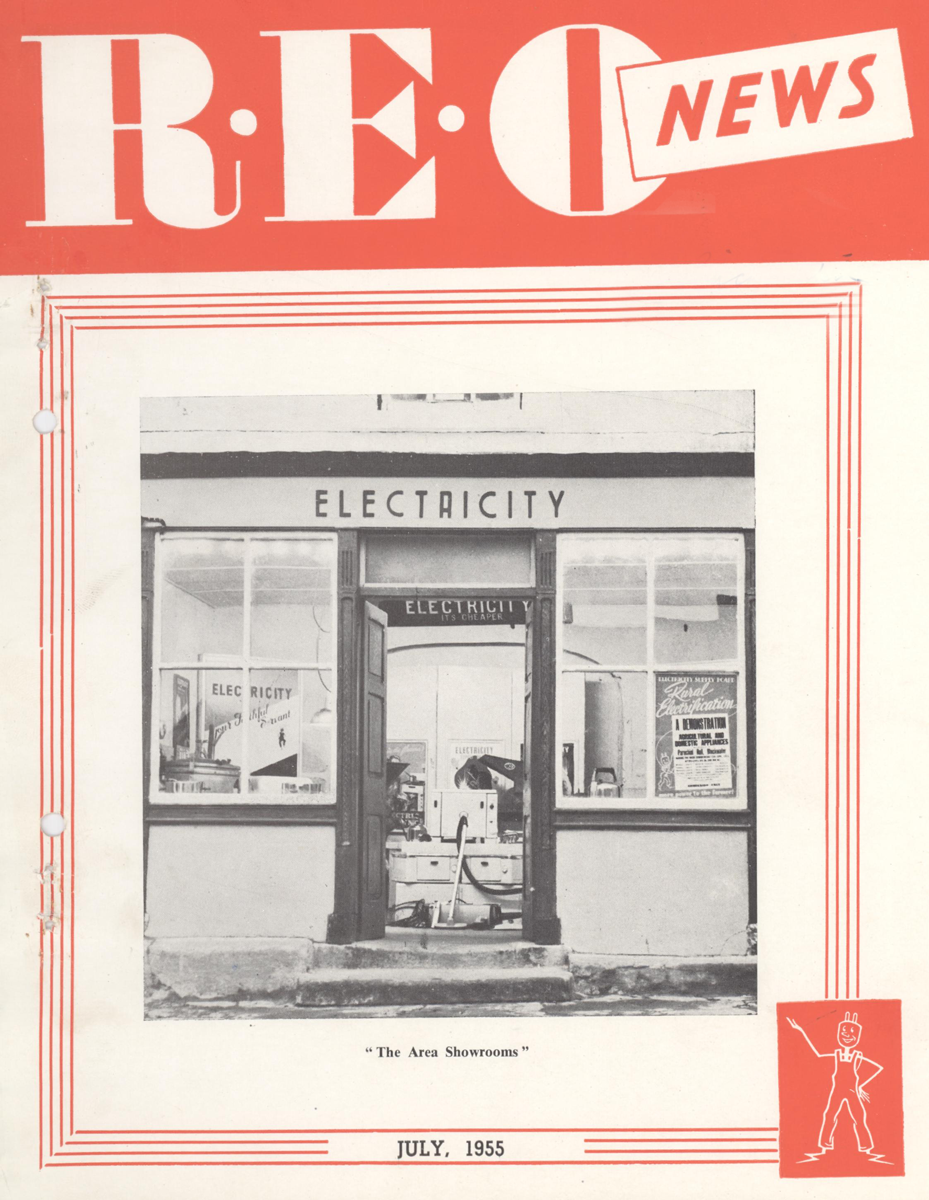 Cover of the REO News newsletter featuring a photograph of a rural electrification demonstration showroom displaying electrical appliances.