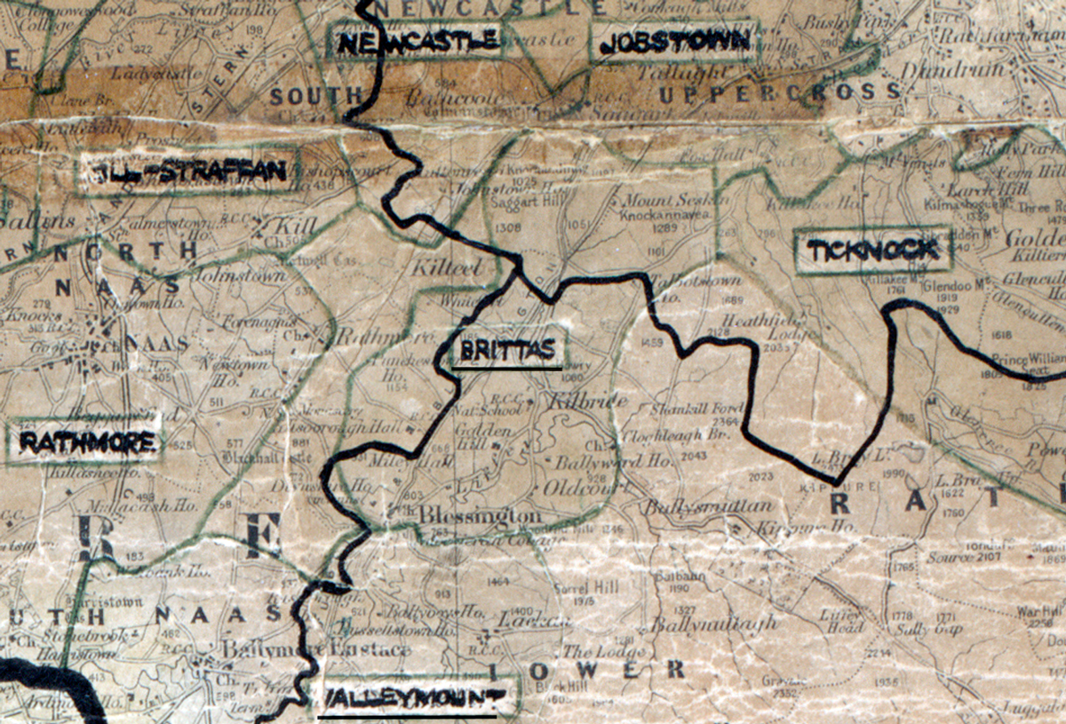 A scanned, worn historical map from the 1940s of the rural electrification area around Brittas. A hand‑drawn boundary outlines the region, including Ticknock and Rathmore.