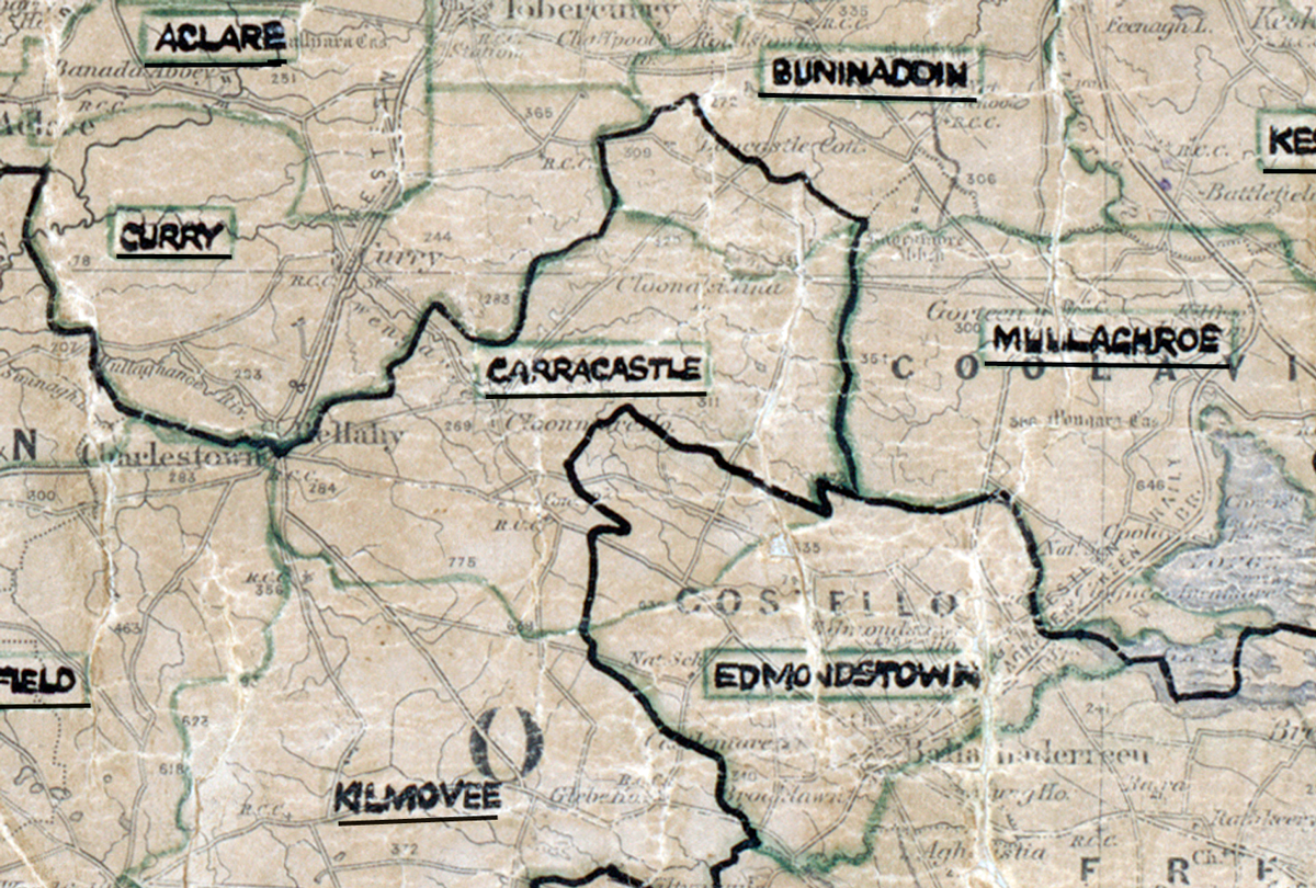 “A scanned, worn historical map from the 1940s of the rural electrification area around Carracastle. A hand‑drawn boundary outlines the region, including Kilmovee and Mullaghroe.