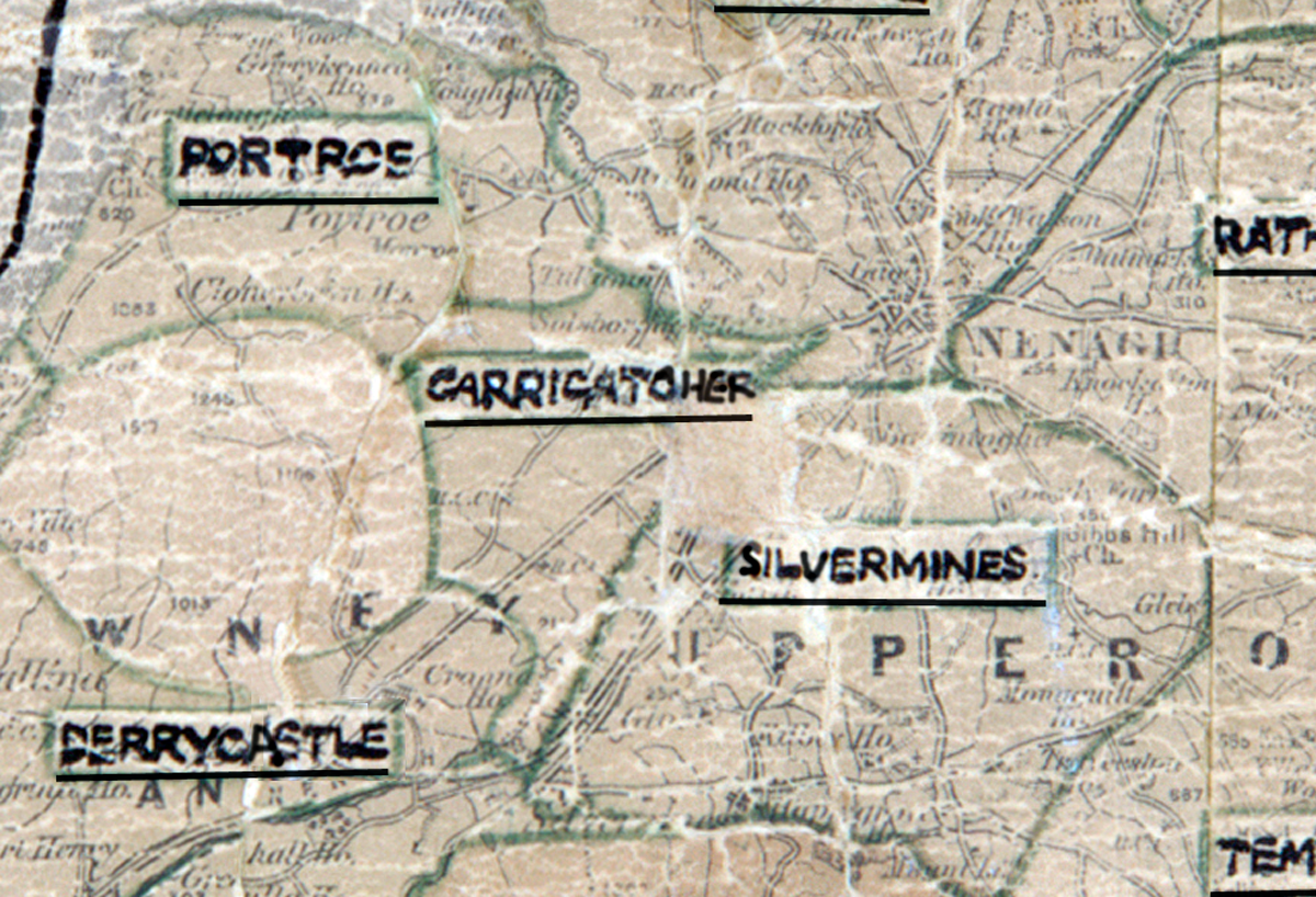 “A scanned, worn historical map from the 1940s of the rural electrification area around Carrigatoher. A hand‑drawn boundary outlines the region, including Silvermines and Derrycastle.