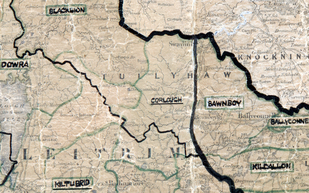 “A scanned, worn historical map from the 1940s of the rural electrification area around Corlough. A hand‑drawn boundary outlines the region, including Bawnboy and Blacklion.