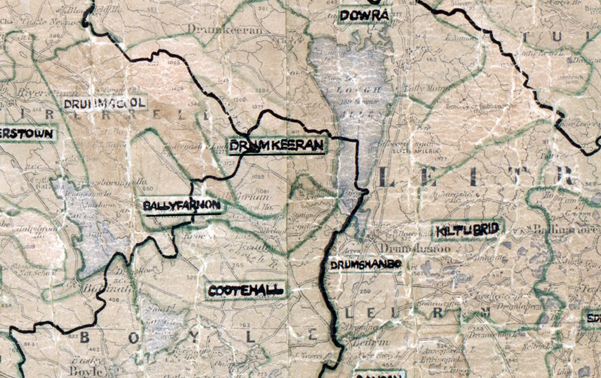 A scanned, worn historical map from the 1940s of the rural electrification area around Drumkeeran. A hand‑drawn boundary outlines the region, including Dowra, Kiltubrid, Drumshanbo, Cootehall, Ballyfarnon, and Drumcoll.