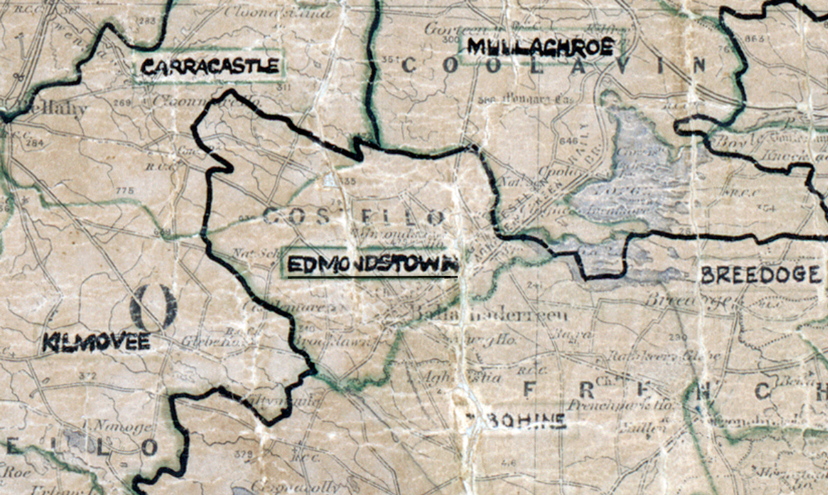 A scanned, worn historical map from the 1940s of the  rural electrification area around Edmondstown. A hand‑drawn boundary outlines the region, including Carracastle, Kilmovee, Breedoge and Mullaghroe.