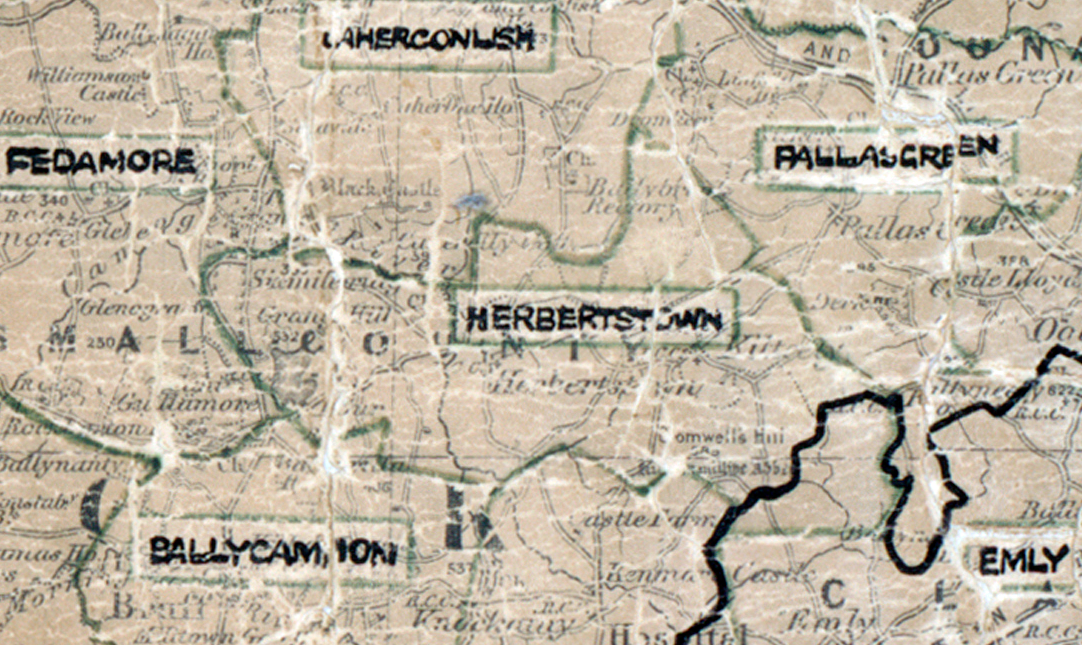 A scanned, worn historical map from the 1940s of the rural electrification area around Herbertstown. A hand‑drawn boundary outlines the region, including Aherconlish, Fedamore, Pallasgreen, Ballycamion, and Emly.