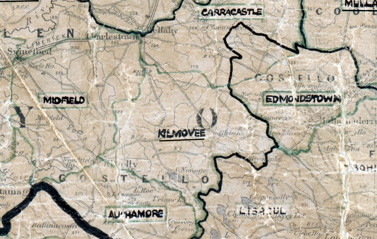A scanned, worn historical map from the 1940s of the rural electrification area around Kilmovee. A hand‑drawn boundary outlines the region, including Midfield, Carracastle, Edmondstown, and Aughamore.