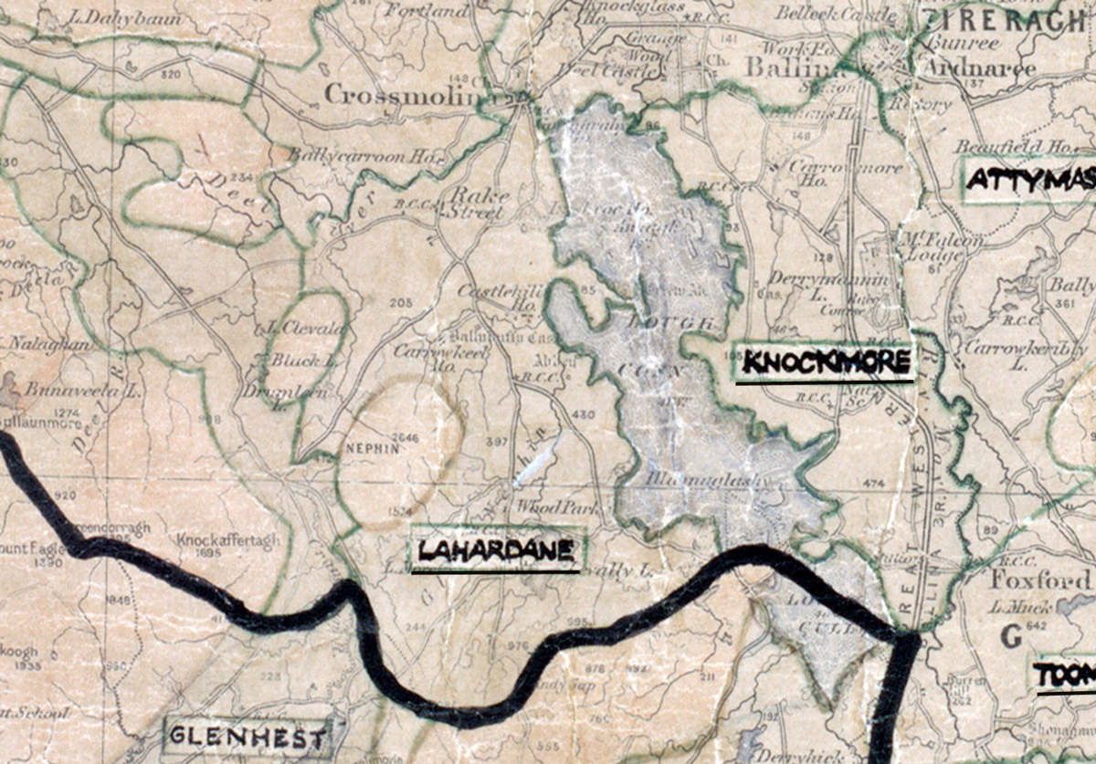 A scanned, worn historical map from the 1940s of the rural electrification area around Lahardane. A hand‑drawn boundary outlines the region, including  Knockmore, Attyass, Glenhest, and Crossmolina.