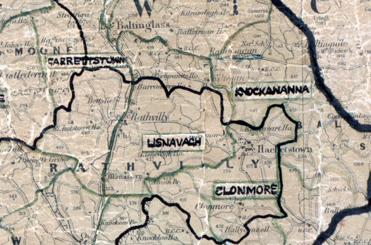 A scanned, worn historical map from the 1940s of the  	rural electrification area around Lisnavagh. A hand‑drawn boundary outlines the region, including Garresttstown, Knockananna and Clonmore.