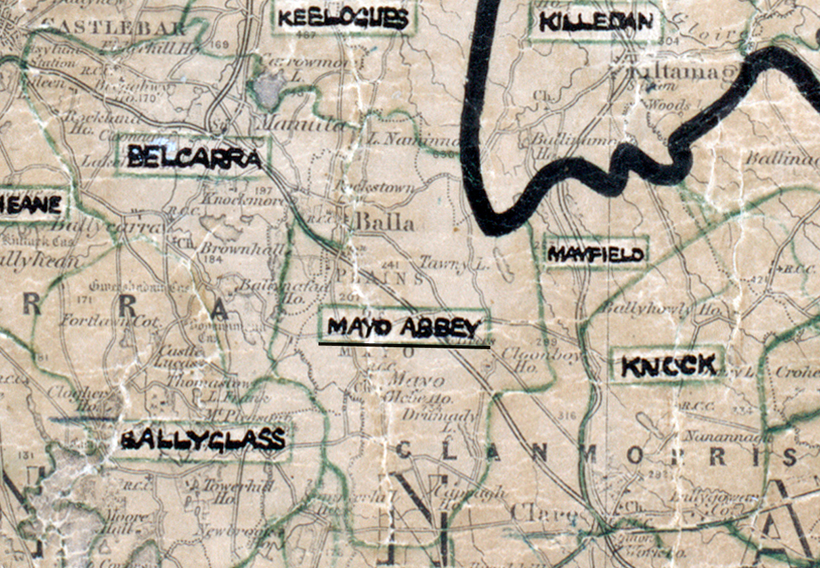 A scanned, worn historical map from the 1940s of the rural electrification area around Mayo Abbey. A hand‑drawn boundary outlines the region, including Belcarra, Ballyglass, Manfield, Knock, and Keelogues.