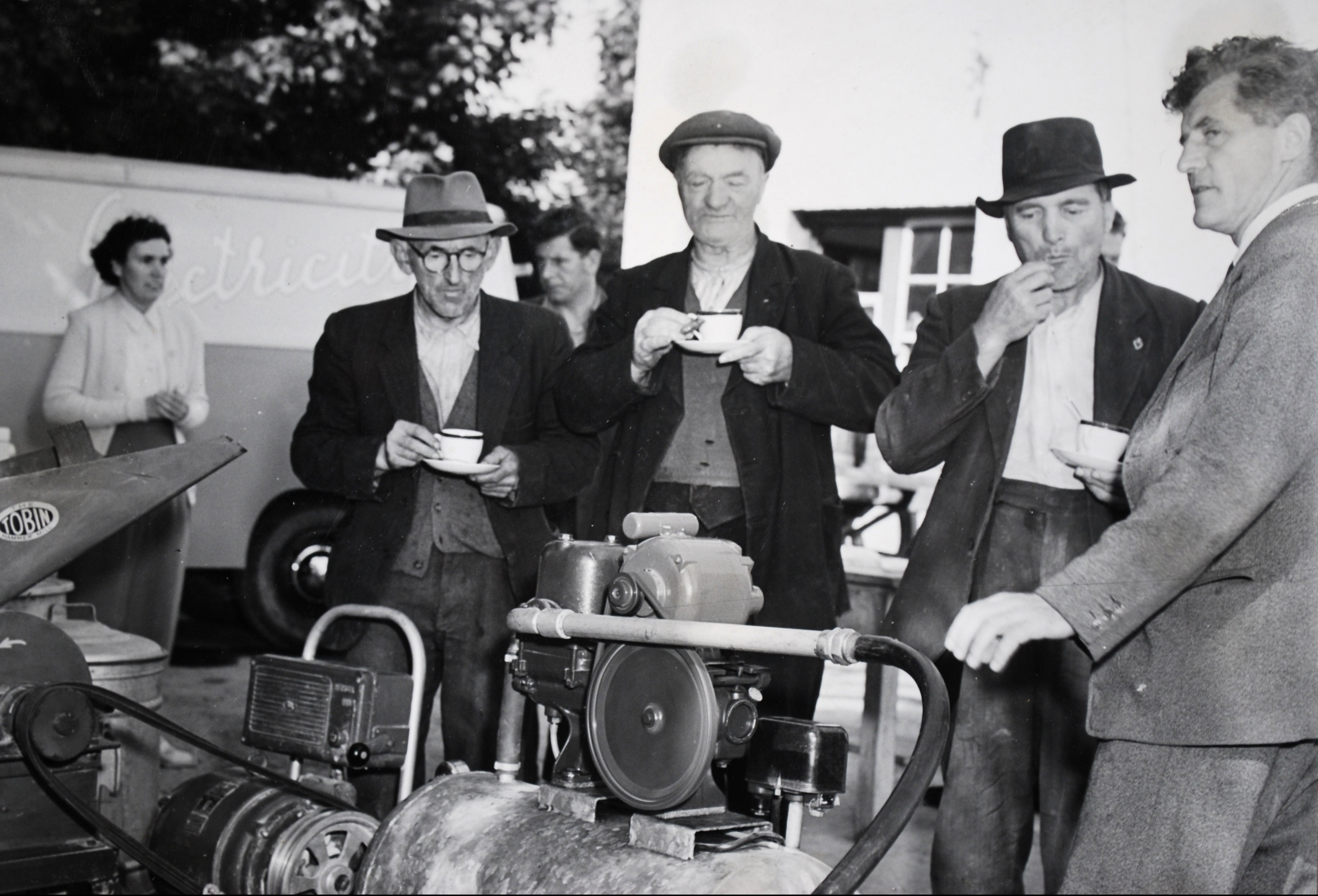 An early morning creamery demonstration, and a breakfast of tea and sausages served by the AO. Ref: RE.PH.3.4