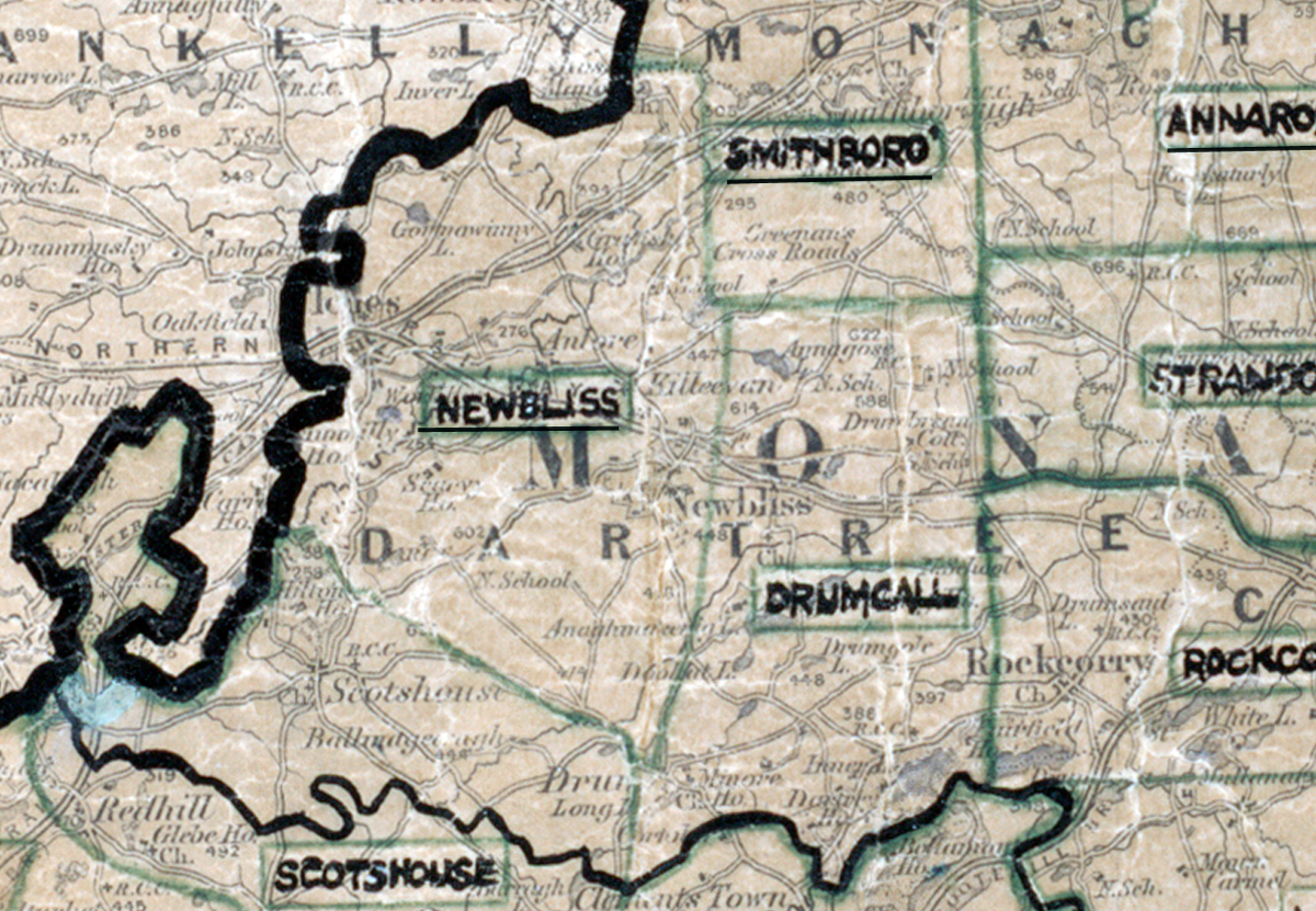 A scanned, worn historical map from the 1940s of the rural electrification area around Newbliss. A hand‑drawn boundary outlines the region, including Smithboro, Drumcall, Rockcorry, and Scotshouse.