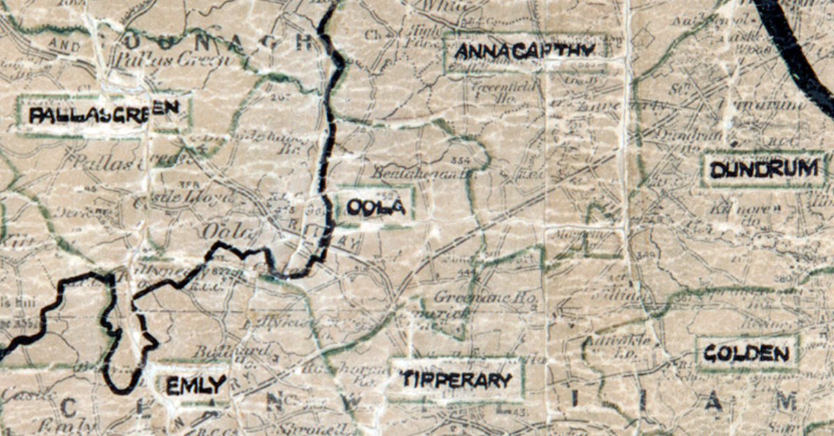 A scanned, worn historical map from the 1940s of the rural electrification area around Oola. A hand‑drawn boundary outlines the region, including Pallasgreen, Annacarty, Dundrum, Golden, Emly, and Tipperary.