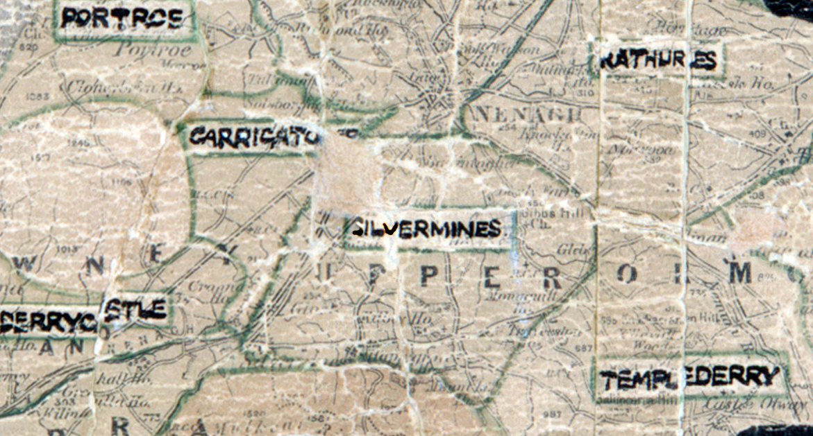A scanned, worn historical map from the 1940s of the rural electrification area around Silvermines. A hand‑drawn boundary outlines the region, including Portroe, Carrigatoher, Rathurles, Templederry, Derrycastle, and Nenagh.