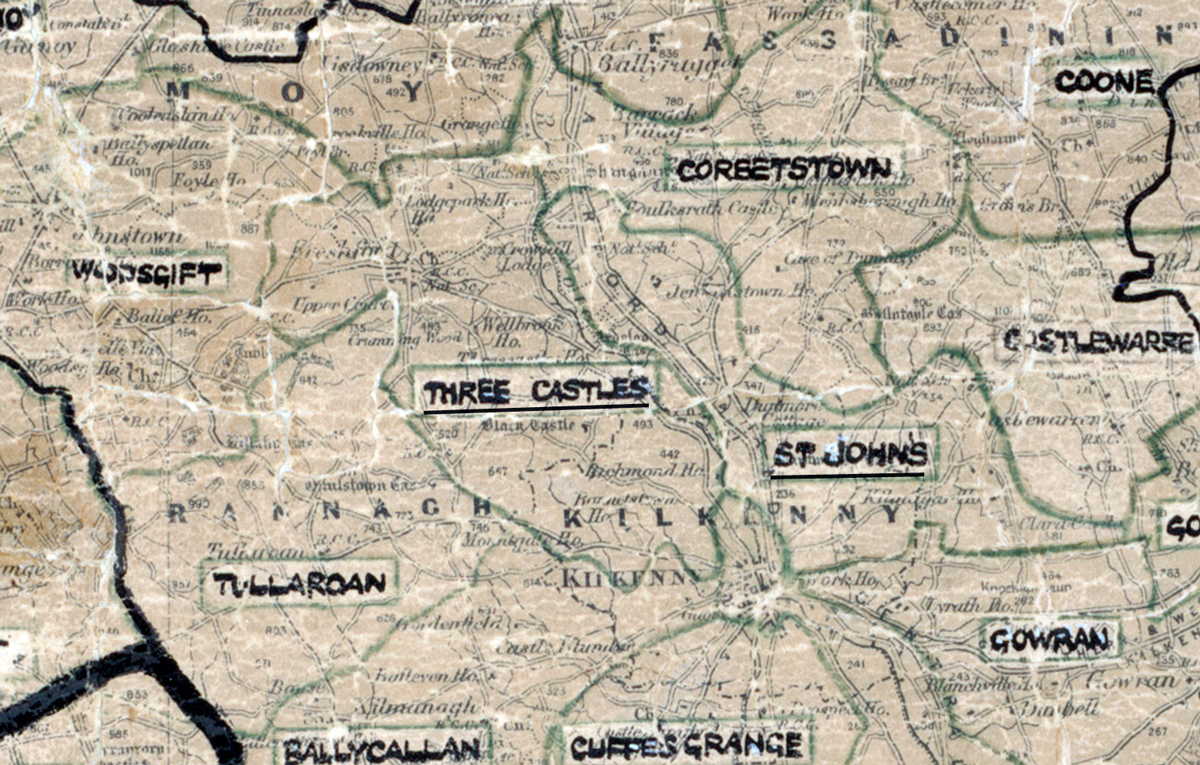 A scanned, worn historical map from the 1940s of the rural electrification area around Three Castles. A hand‑drawn boundary outlines the region, including Woodsgift, St. John’s, Tullaroan, Cuffesgrange, Gowran, Coone, and Castlewarren.