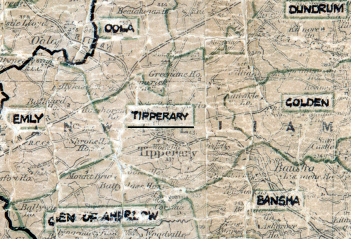 A scanned, worn historical map from the 1940s of the rural electrification area around Tipperary. A hand‑drawn boundary outlines the region, including Emly, Oola, Dundrum, Golden, Bansha, and Glen of Aherlow.