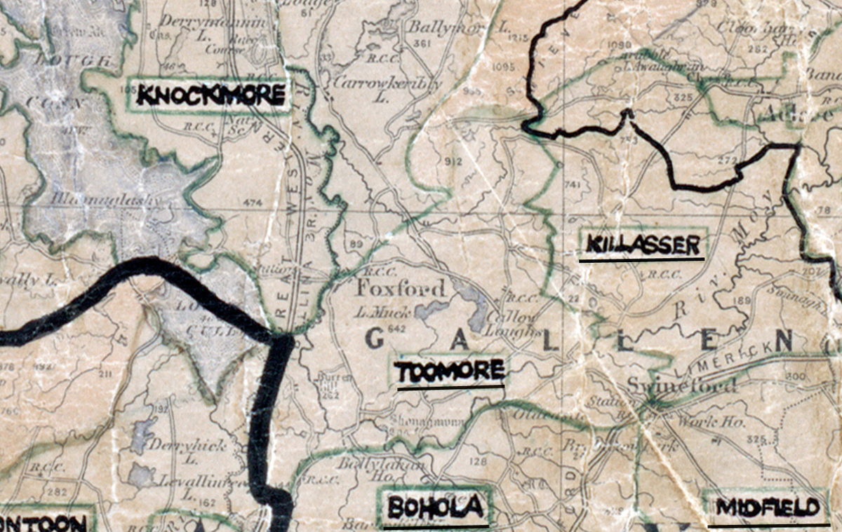 A scanned, worn historical map from the 1940s of the rural electrification area around Toomore. A hand‑drawn boundary outlines the region, including Knockmore, Foxford, Bohola, Killasser, and Midfield.