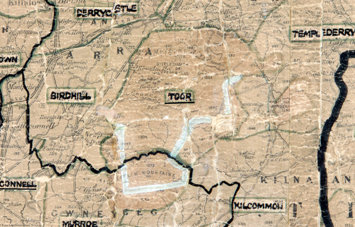 A scanned, worn historical map from the 1940s of the rural electrification area around Toor. A hand‑drawn boundary outlines the region, including Derrycastle, Birdhill, Kilcommon, and Templederry.