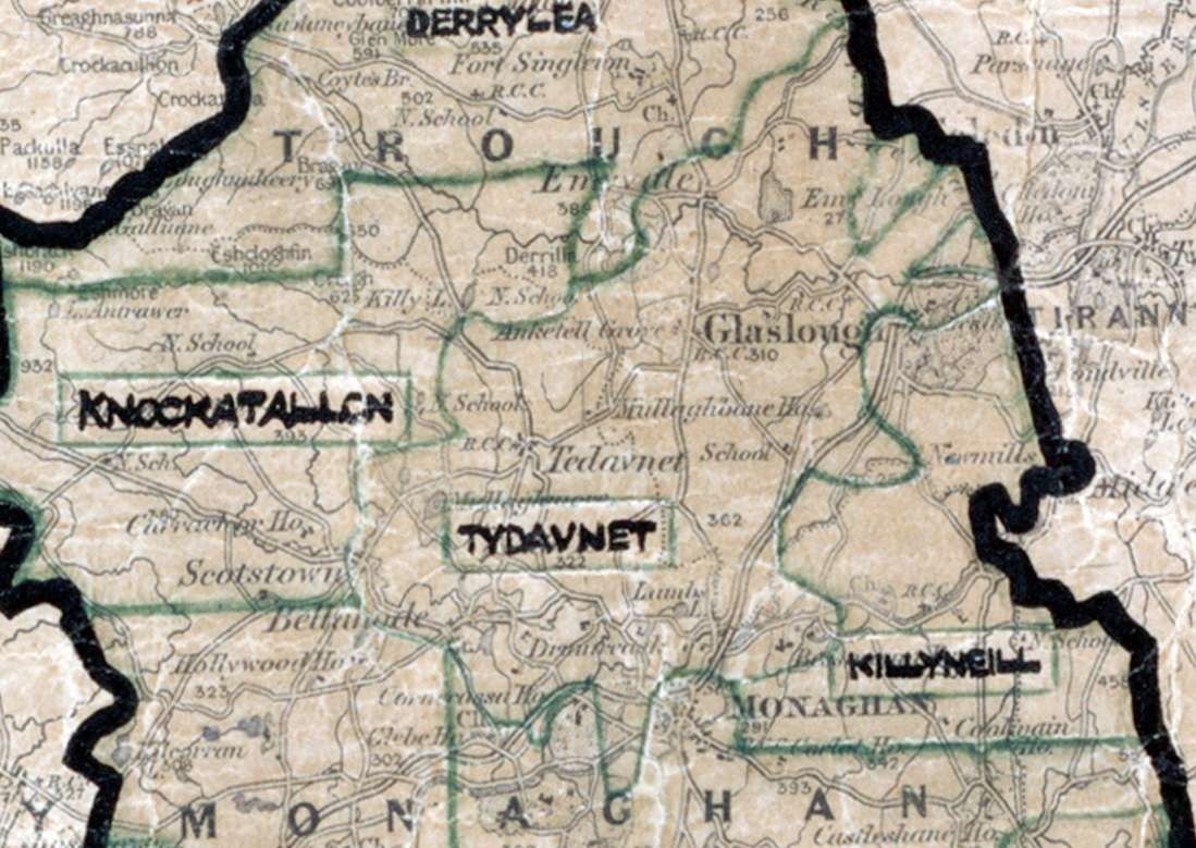A scanned, worn historical map from the 1940s of the rural electrification area around Tydavnet. A hand‑drawn boundary outlines the region, including Derryvea, Knockatallen, Glaslough, and Killyneill.