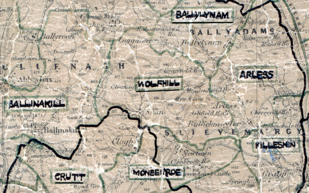 A scanned, worn historical map from the 1940s of the  rural electrification area around Wolfhill. A hand‑drawn boundary outlines the region, including Ballynam, Ballynakill, Grutt, Moneriroe, Arless and Filleshin.